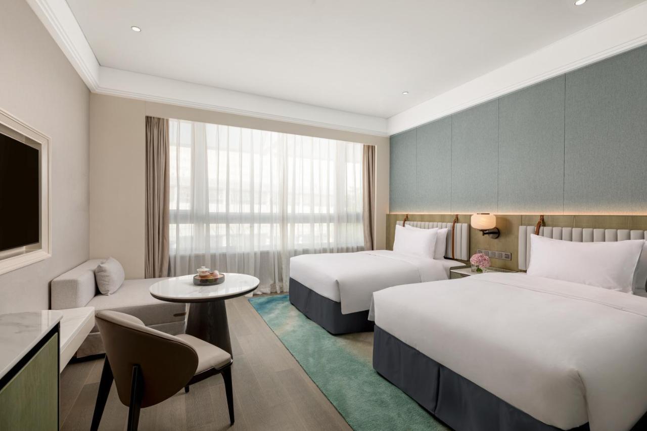 Xiamen International Seaside Hotel -Hotel Corridor Leads To The Stone Exhibition Hall Quarto foto